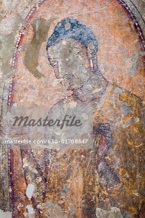 Fresco of Buddha on the wall of a cave, Ajanta, Maharashtra, India