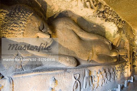 Statue of Reclining Buddha in a cave, Ajanta, Maharashtra, India