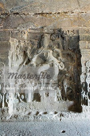 Statue of Hindu god in a cave, Ellora, Aurangabad, Maharashtra, India