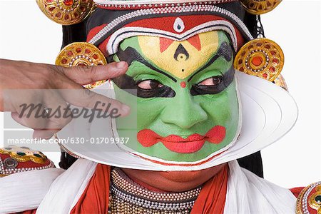 Close-up of a Kathakali dance performer gesturing