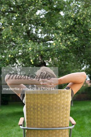 Relaxed man sitting in a lawn chair