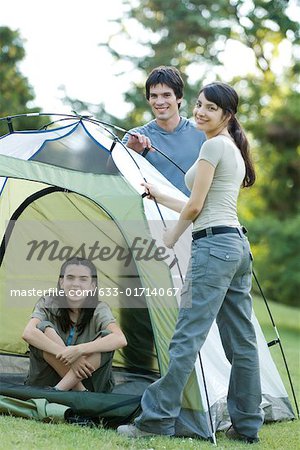 Young campers setting up tent