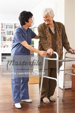 Senior Woman Receiving Assistance with Using Walker