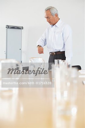 Businessman Waiting in Boardroom