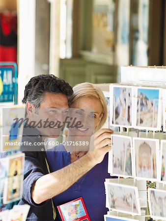 Couple Looking at Postcards