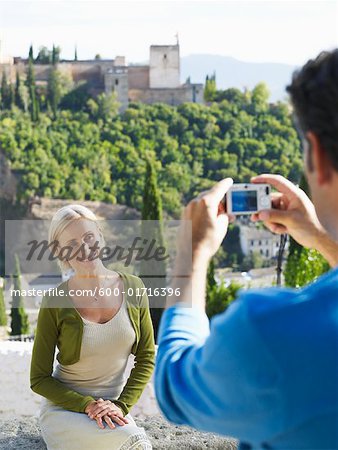 Man Taking Picture of Woman