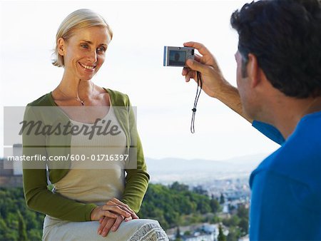 Man Taking Picture of Woman
