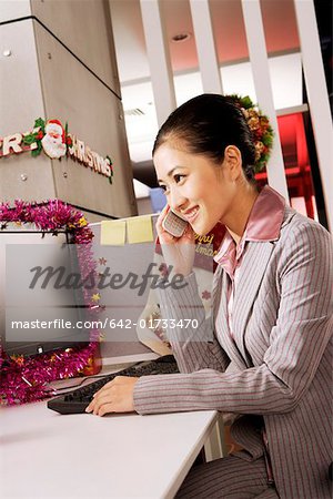 Businesswoman communicating on mobile phone