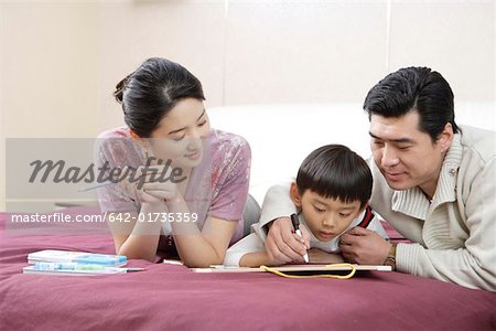 Family drawing in bed