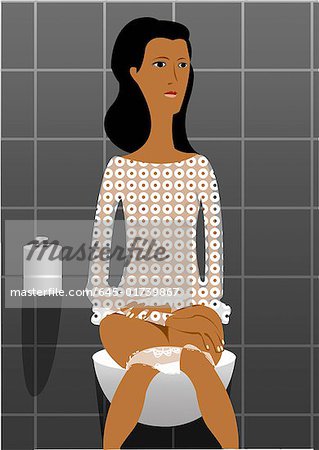 Young woman sitting on toilet