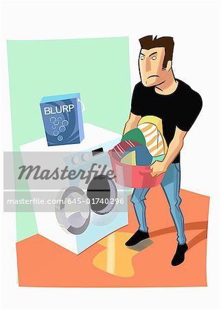 Man emptying washing machine of laundry