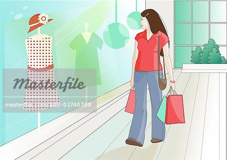 Woman with shopping bags browsing a store window
