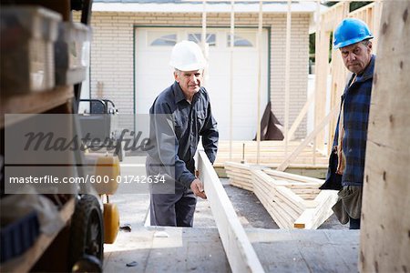 Construction Workers Building Addition on Home