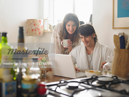 Couple in Kitchen Starting the Day