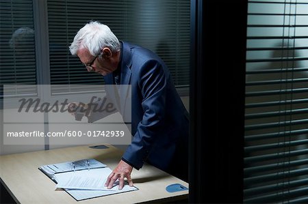 Businessman Photographing Document