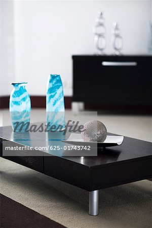 Ball with a tray and two decorative glass vases on a table