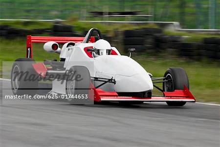 Racecar racing on a motor racing track