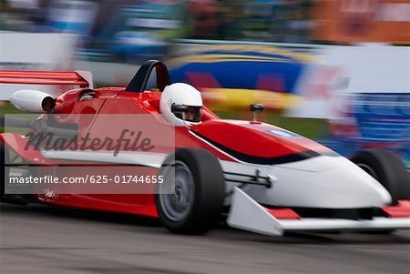 Racecar racing on a motor racing track