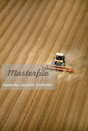 Aerial, plowing farm field