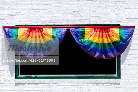 Close-up of a rainbow curtains hanging on a window