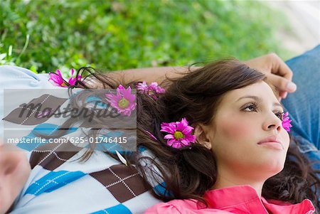 Close-up of a young woman lying on a young man