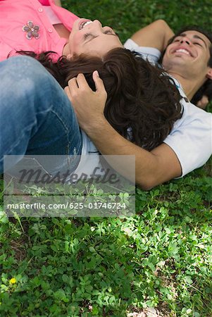 Young couple lying in a park