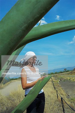 Side profile of a mid adult woman standing in a field