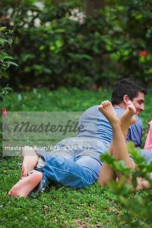 Young couple lying in a park