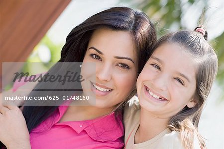 Portrait of a girl with her mother smiling