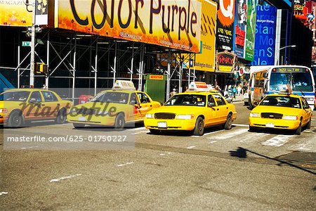 Yellow taxis on a road in a city, Times Square, Manhattan, New York City, New York State, USA
