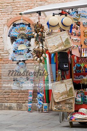 Craft products hanging in a market stall, Venice, Italy