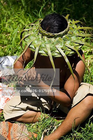 Close-up of a man sitting in a field, Maui, Hawaii Islands, USA