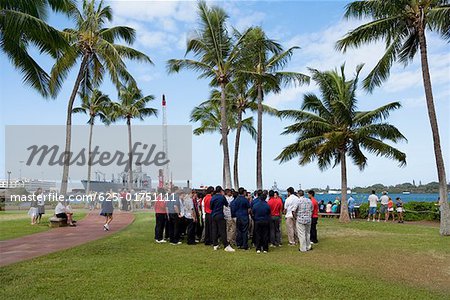 Group of people standing in a park, Pearl Harbor, Honolulu, Oahu, Hawaii Islands, USA