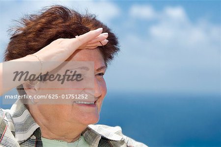 Close-up of a senior woman saluting