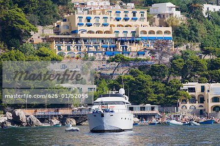 Passenger ship in the sea with buildings in the background, Capri, Campania, Italy