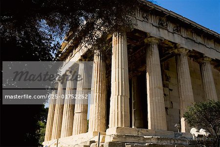 Low angle view of the old ruins of a temple, Parthenon, Acropolis Athens, Greece
