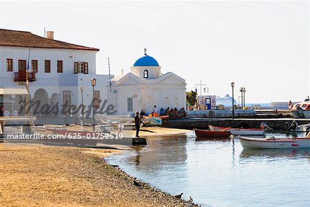 Boats in front of a church, Mykonos, Cyclades Islands, Greece