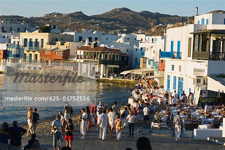 Large group of people standing at the coast, Mykonos, Cyclades Islands, Greece