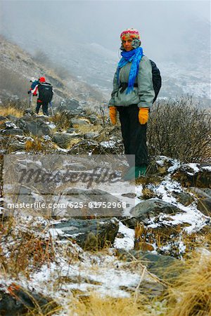 Portrait of a female hiker standing on a mountain, Machhapuchhare, Annapurna Range, Himalayas, Nepal