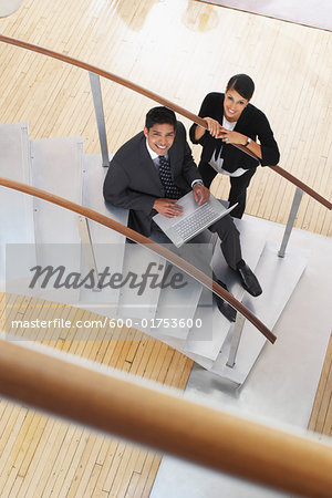 Businessman and Woman on Staircase