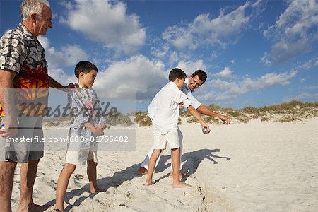 Family Playing Bocce on the Beach