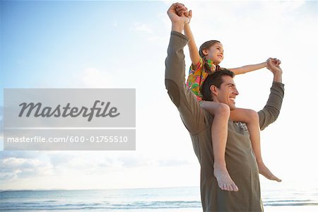 Father Giving Daughter Piggyback Ride