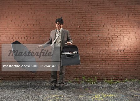 Businessman in Wind, New York City, New York, USA