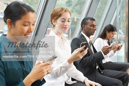 Business People in Foyer with Electronic Organizers, Toronto, Ontario, Canada