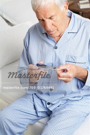 Man Testing Blood Sugar