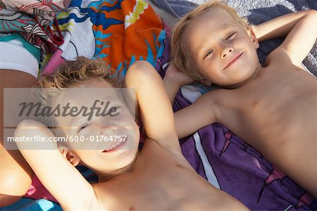 Brothers Lying on Beach Blanket, Majorca, Spain