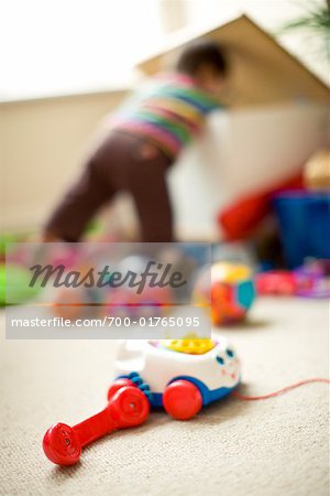 Child Looking in Toy Box