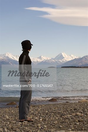 Man Looking over Lake and Mountains, Lake Pukaki, Mount Cook, Canterbury, New Zealand