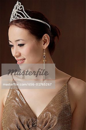 woman wearing crown, looking away from camera, beauty queen