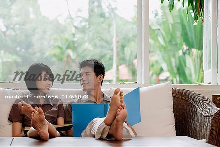 A young couple read together